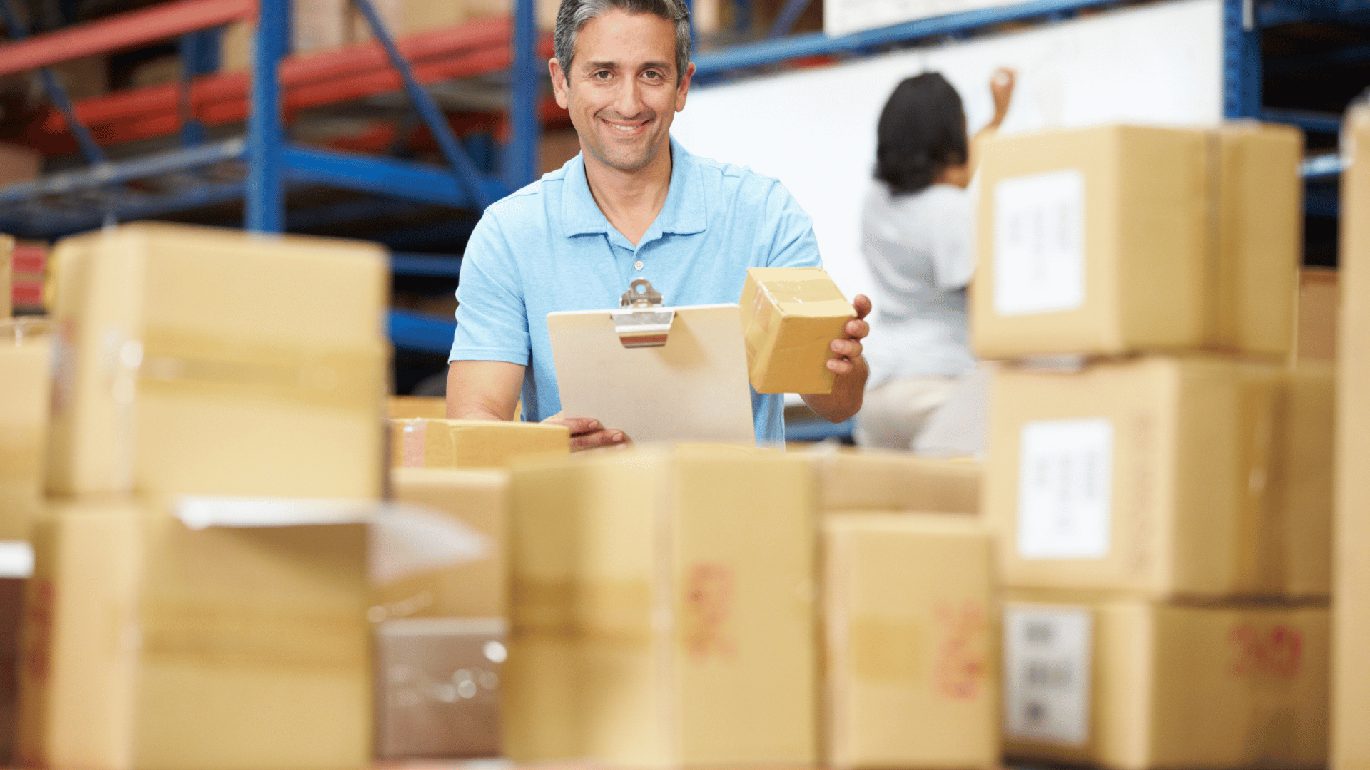 Warehouse worker directing FIFO putaway on Stacket WMS